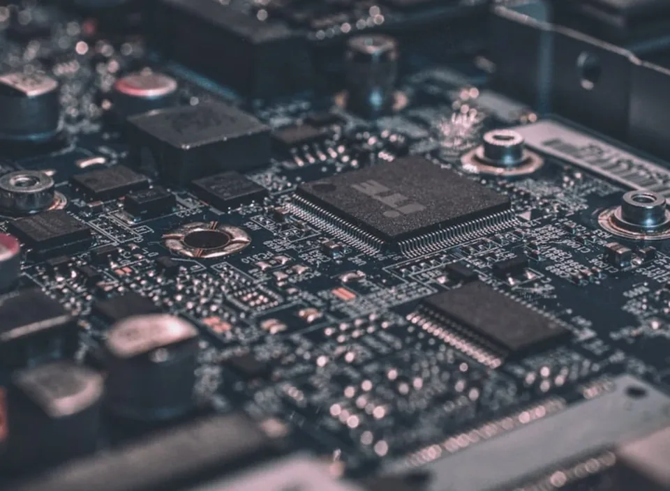 A close macro of a circuit board with chips and solder joints